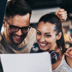 Couple looking into laptop